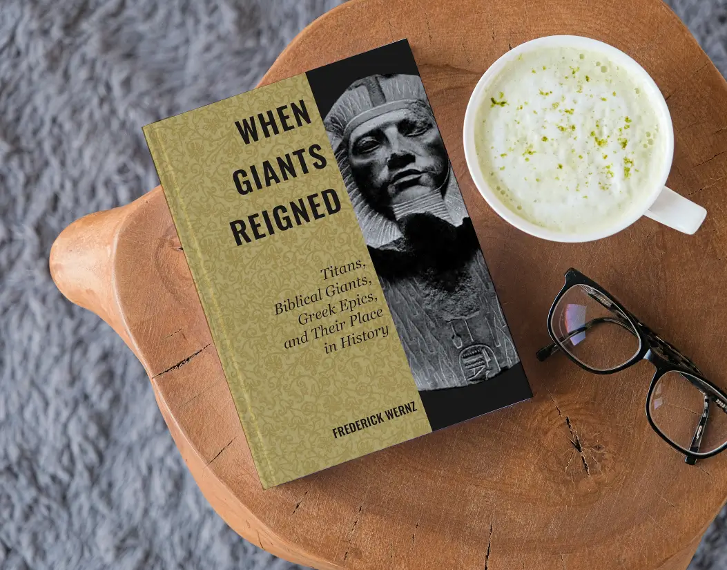 Book, glasses, and coffee on wooden table.